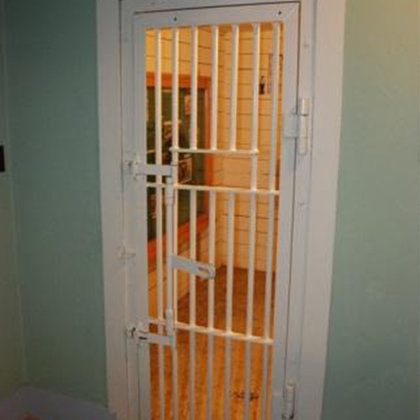 Located in the Bashan Alberta fire hall (now a museum) this jail cell used to be attached to the Sheriff's office. For our use, the office would be transformed into the kitchen.