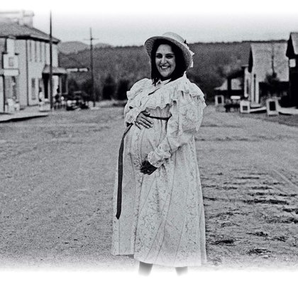 Main street Fort Steele, to be used for exterior shots of town life in the 1880s (horse buggies and background actors creating the activity).  This is a maternity dress from the period (recent photo) made in Fort Steele's actual functioning seamstress shop!  Many costumes from that shop will be used in the series.  Fort Steele (near Cranbrook, BC) will be the main shooting location.
